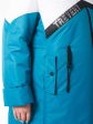 Молодежное дутое пальто цвета морской волны с белой отделкой , цвет бирюзовый в интернет-магазине Фабрики Тревери