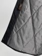 Пальто зимнее из плащевки с норкой и декоративной подвеской, цвет черный в интернет-магазине Фабрики Тревери