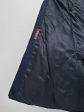 Женское зимнее пальто с контрастной отделочной строчкой и норкой крестовкой, цвет синий в интернет-магазине Фабрики Тревери