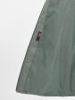 Молодежное комбинированное стеганное пальто с нашивкой и цветной отделкой, цвет зеленый в интернет-магазине Фабрики Тревери